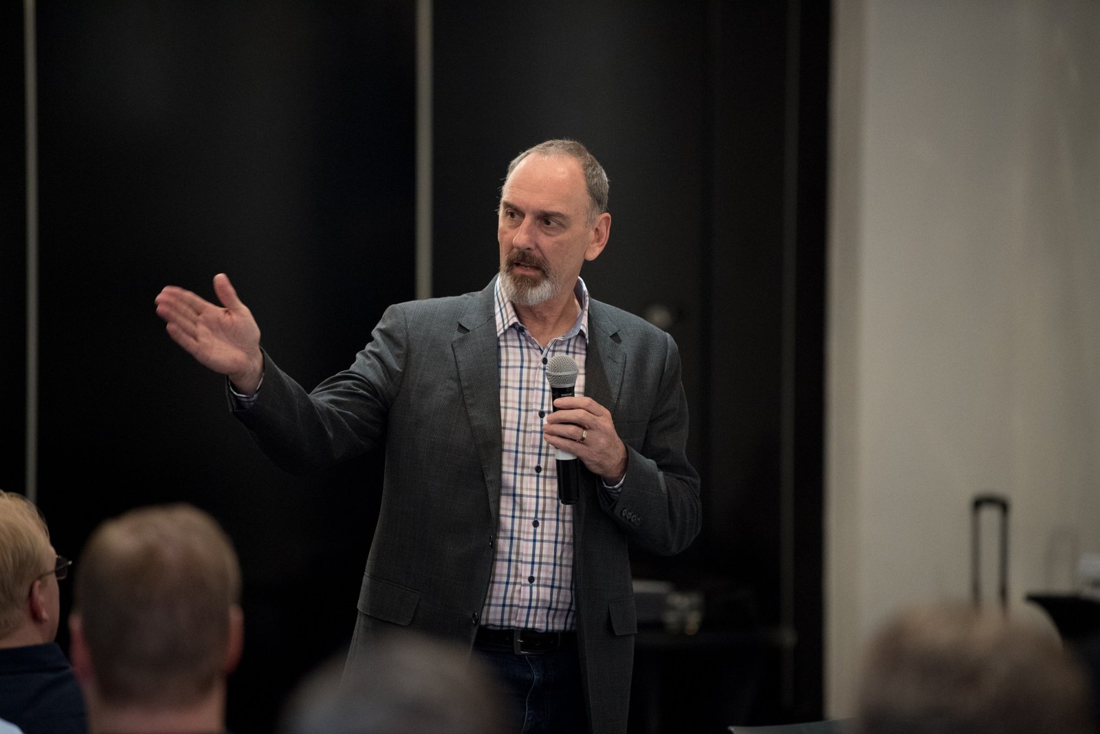 Steve Simpson engaging an audience from the stage