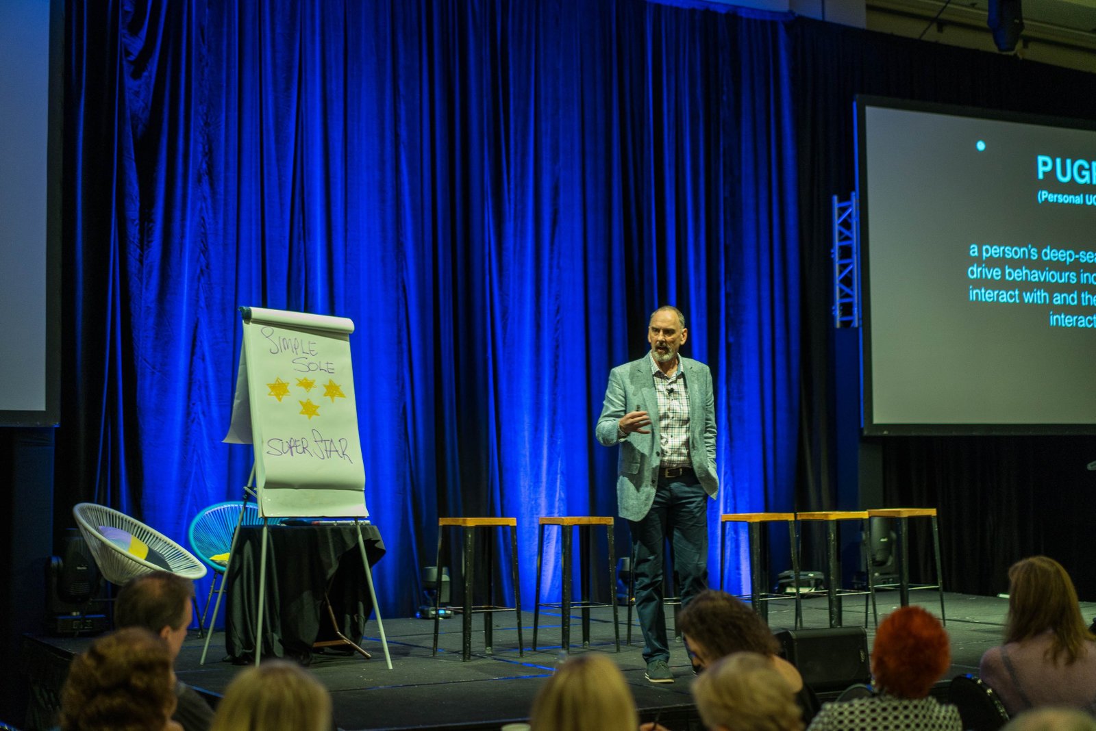 Steve Simpson presenting on a conference stage
