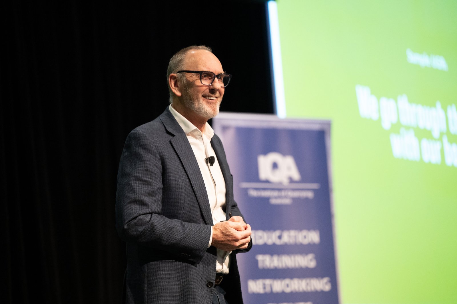 Steve Simpson speaking with energy at a conference
